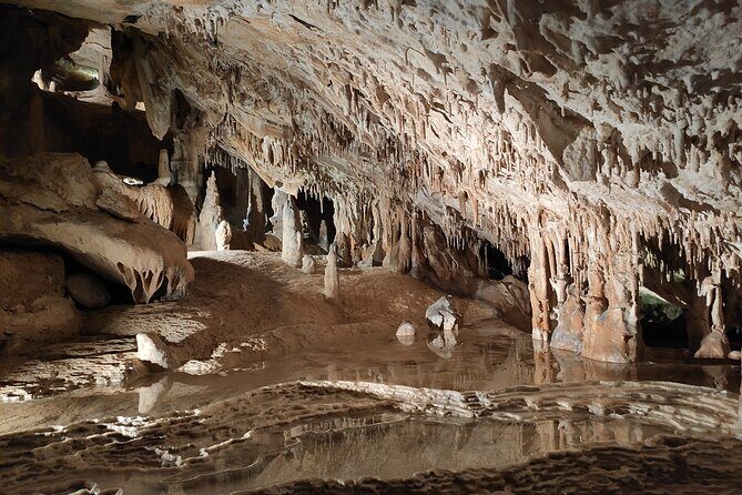 Can Marca, Las Dalias Hippie Market and Benirras Tour - Can Marçà Cave: 100,000-Year Views Plus a 10-Metre Water Show