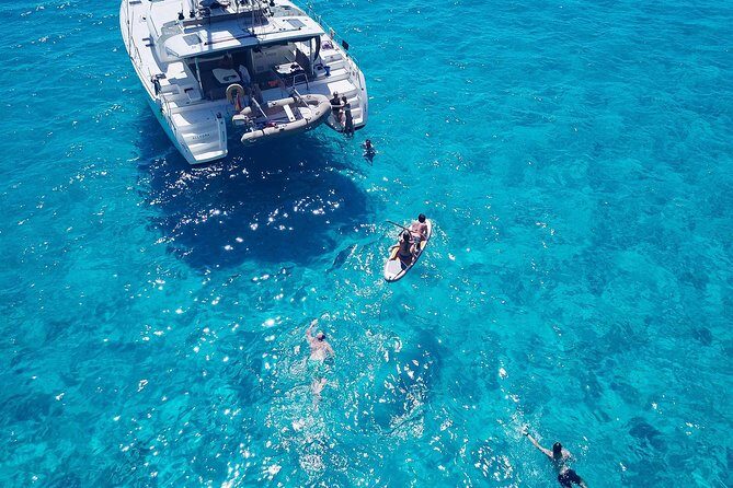 Discover Cala Bassa and Cala Comte on board a catamaran - Cala Bassa and Its Caves: The First Big Why