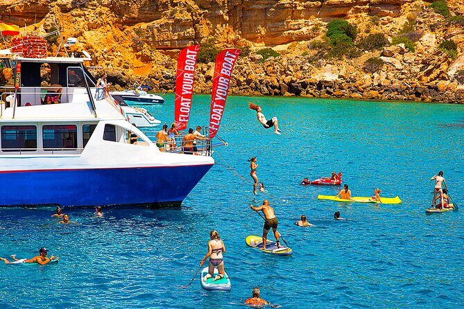 Ibiza Beach Hopping Cruise with Paddleboards, Drinks and Food 6h - A 6-hour catamaran day that mixes beaches and active water time