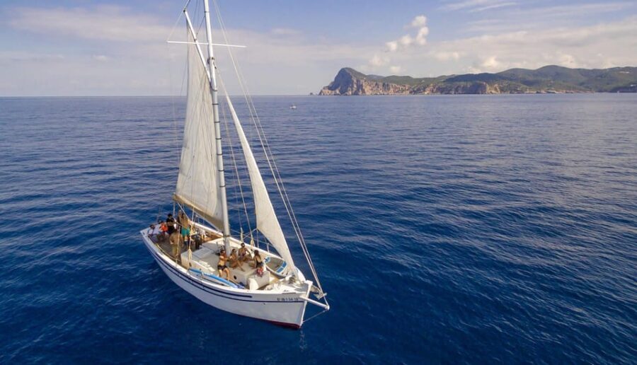 Ibiza: Private Sailboat with Premium Open Bar, Food & Music - Entering the 1930s Wooden-Yacht Feel at Sant Antoni Port
