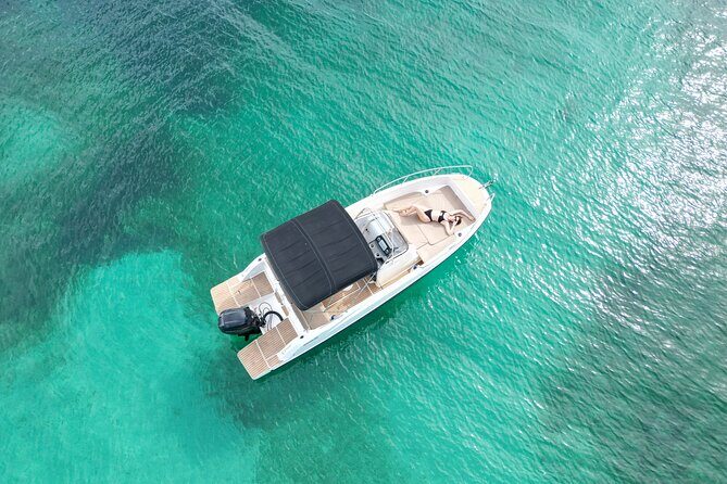 Private Boat Tour of San Antonio with Paddel surfing and Snorkeling - Stop 1: Port des Torrent for your first board-and-snorkel session
