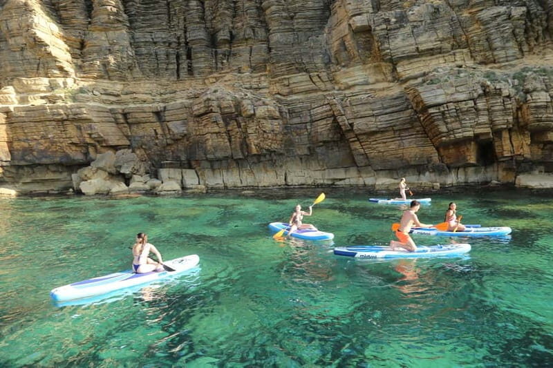 San Antonio: Cala Bassa, Cala Conta and Cave Boat Trip - Cala Conta stop: walk, snorkel, and paddle surf