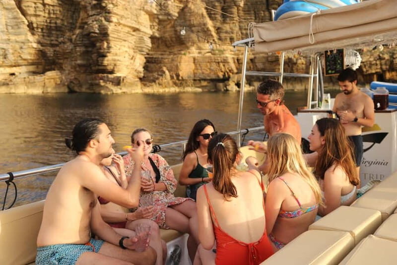 San Antonio: Cala Salada & Cala Gracio Sunset Boat Trip - Food and Drinks at Sea: Tapas + Open Bar = Easy Social Time