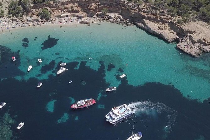 Sunset Beach Hopping Cruise, Cala Comte and Cala Bassa, SUP and snorkelling - Cala Bassa swim stop: clear water and onboard water toys